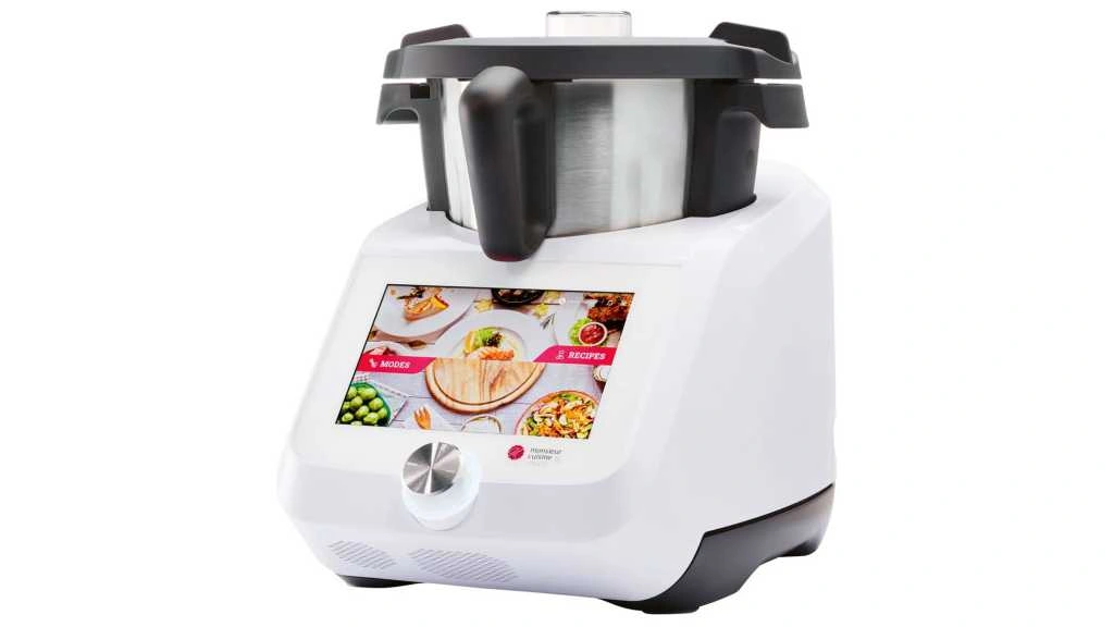 Silvercrest Monsieur Cuisine Smart kitchen appliance with touchscreen and stainless steel cooking pot on white base.