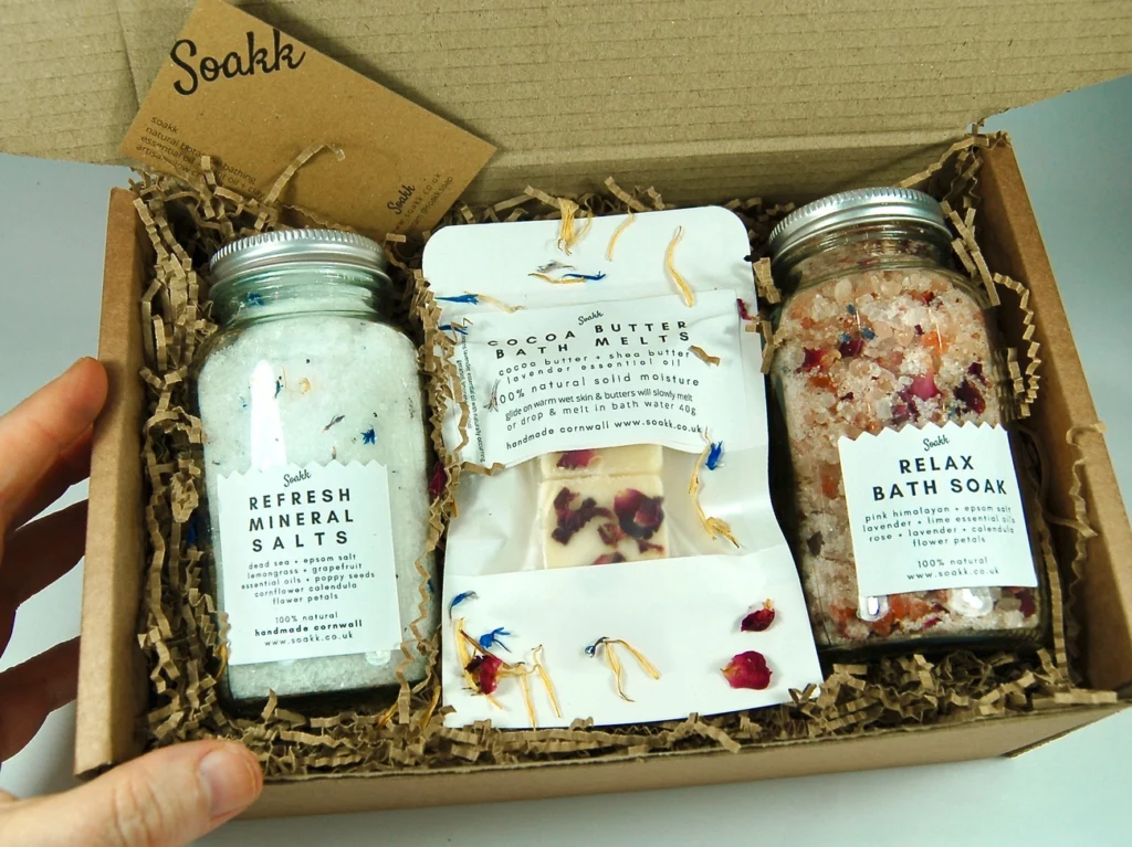 Soakk bath salts gift set with Refresh Mineral Salts, Cocoa Butter Bath Melts, and Relax Bath Soak in a cardboard box.